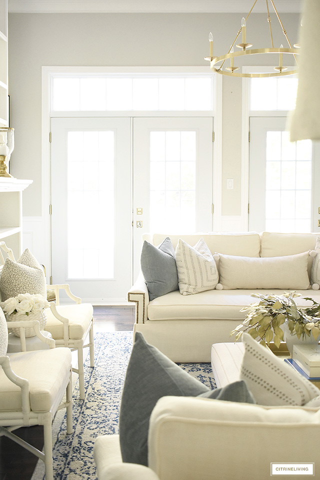 Casual and elegant fall living room with warm neutrals, muted colors and soft gold touches, is laid-back but still sophisticated and tailored.