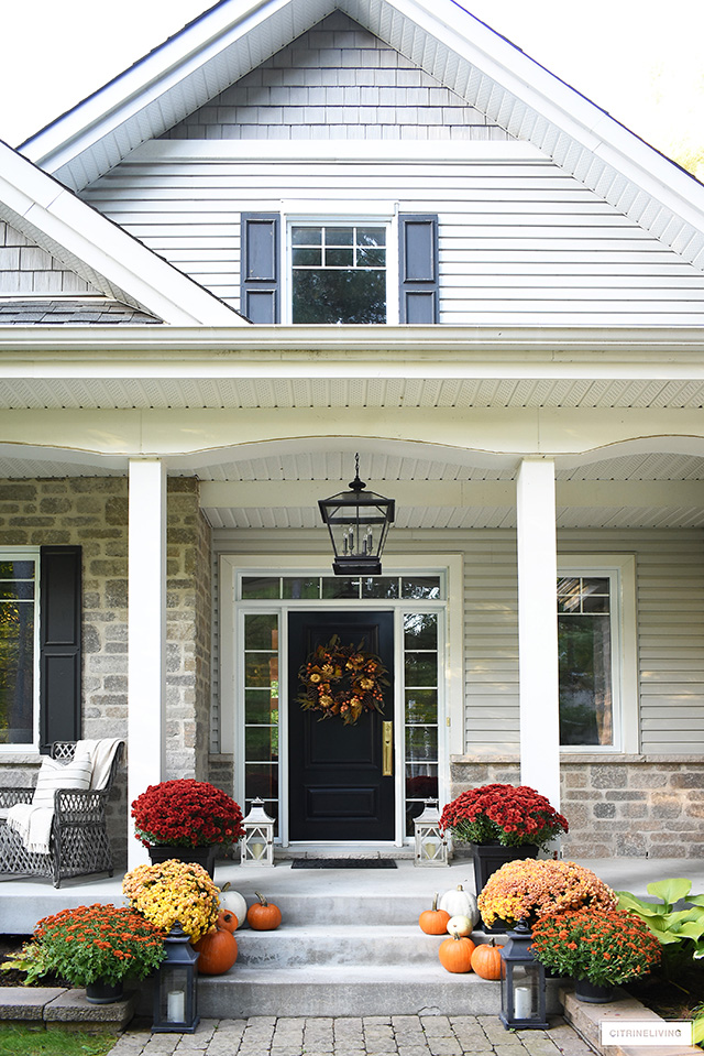 Create a stunning fall front porch and welcome your guests with bright, colourful mums, scattered pumpkins and a large scale wreath.
