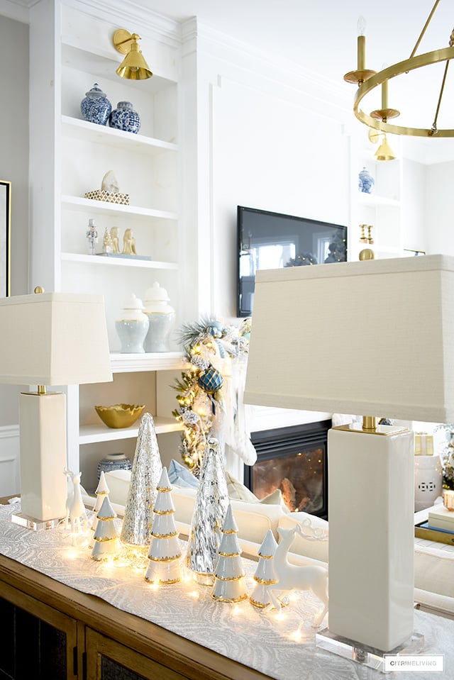 Console decorated with scattered Christmas trees and lights.