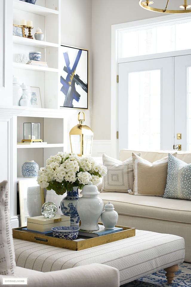 Spring decorating ideas - faux florals, blue and white, ginger jars and beautiful printed throw pillows.