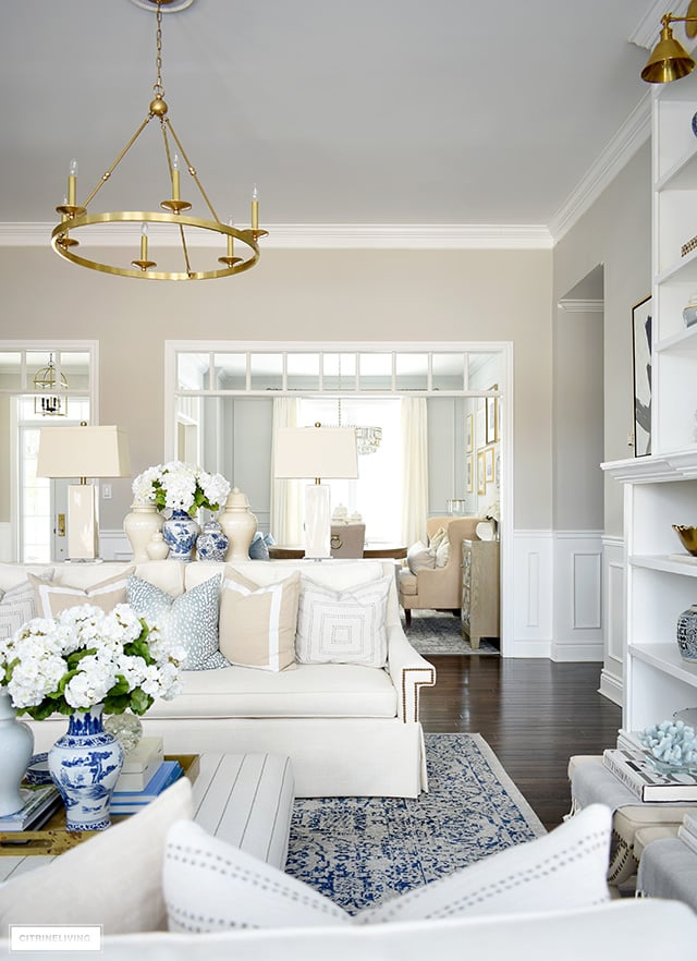 Living room decorating ideas for spring - a soft blue, beige and warm white color palette is fresh and airy.