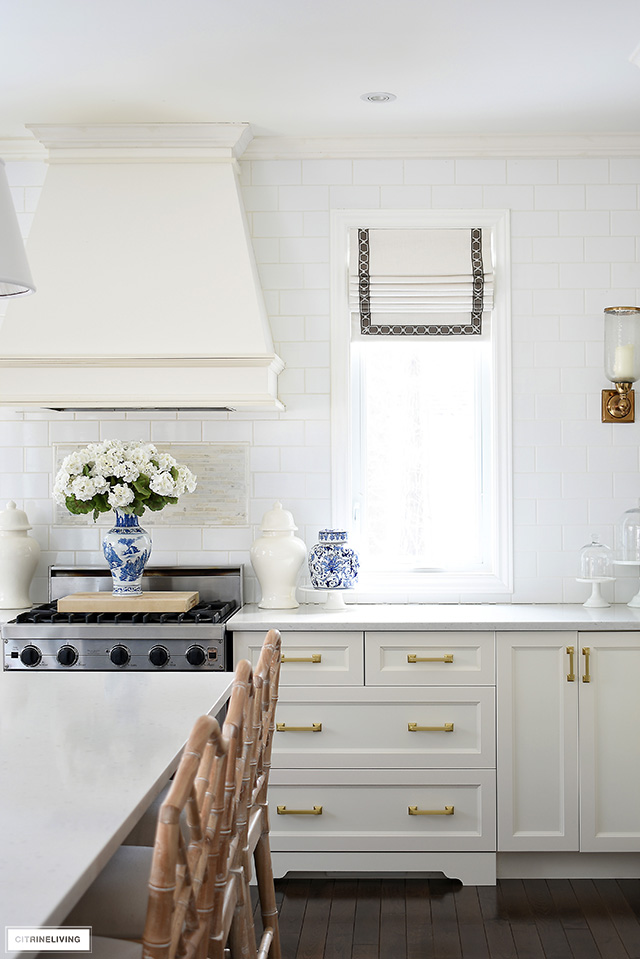 A chic and sophisticated kitchen with blue and white accessories for spring.