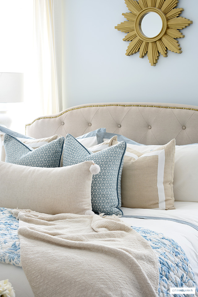 https://citrineliving.com/wp-content/uploads/2020/04/how-to-style-a-bed-with-pillows-blue-and-beige-3.jpg