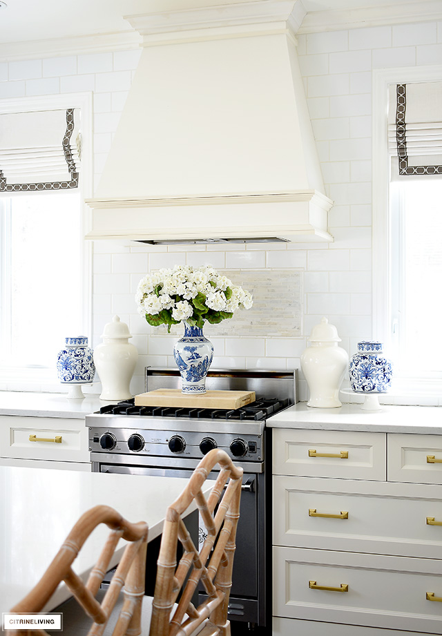 Make a spring statement in the kitchen with beautiful blue and white ginger jars and vases and faux florals.