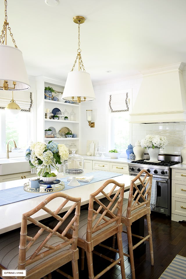 Kitchen with Chippendale bar stools, blue and white accessories for summer.