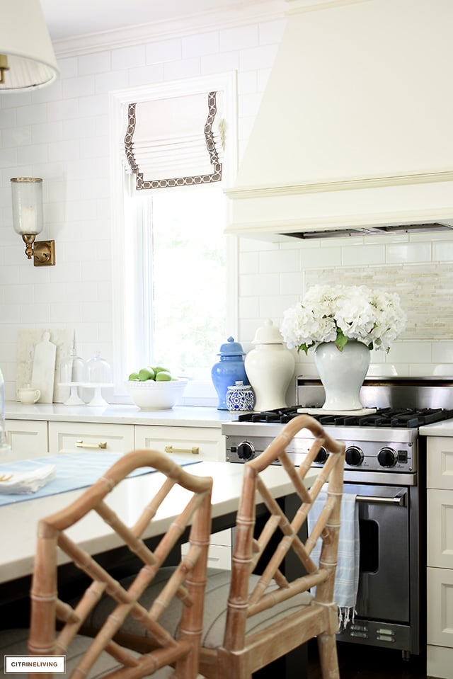 Kitchen decorating details wit ginger jars and faux hydrangeas.