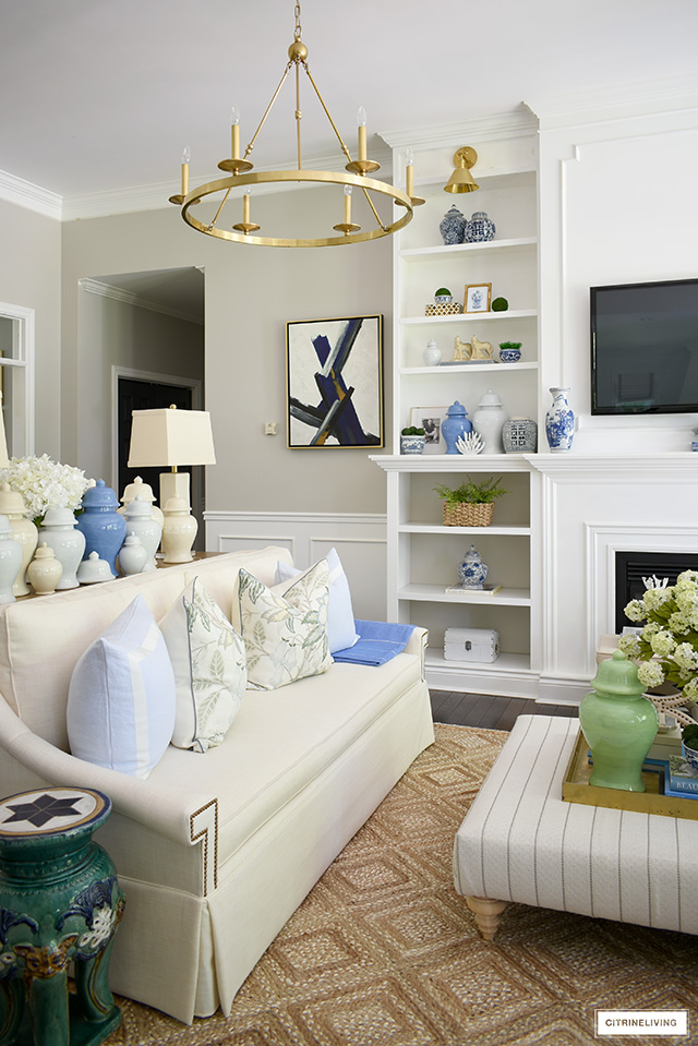 Gorgeous summer decorated living room with pretty blue, green and natural accents.