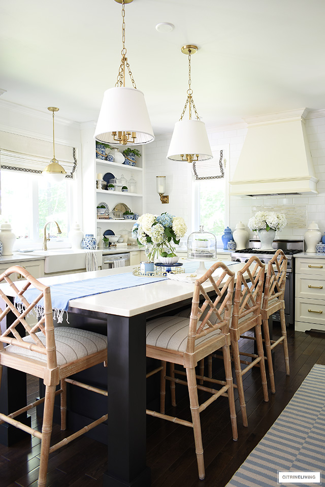 Kitchen decorating with summer touches - blue and white, striped rugs and hydrangeas.