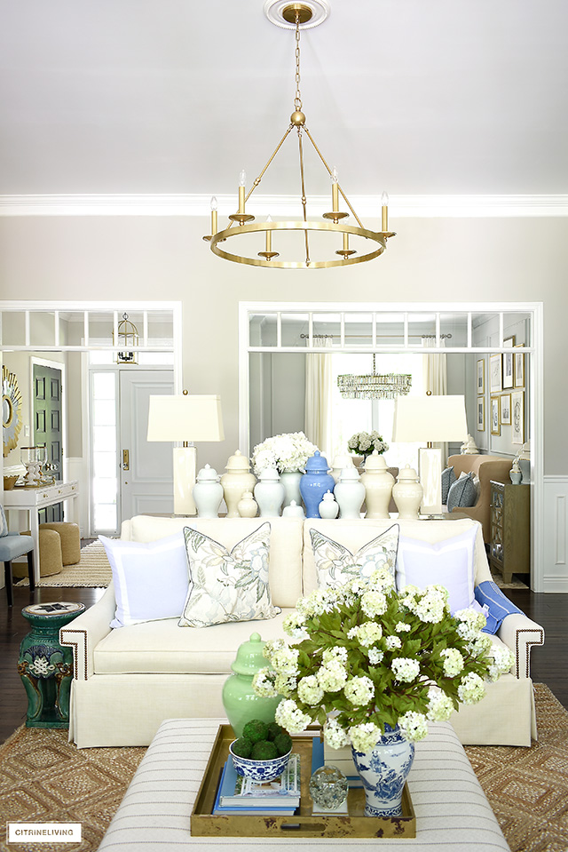 Gorgeous summer living room decorated with a fresh blue, green and natural palette is light and airy for the warm months!