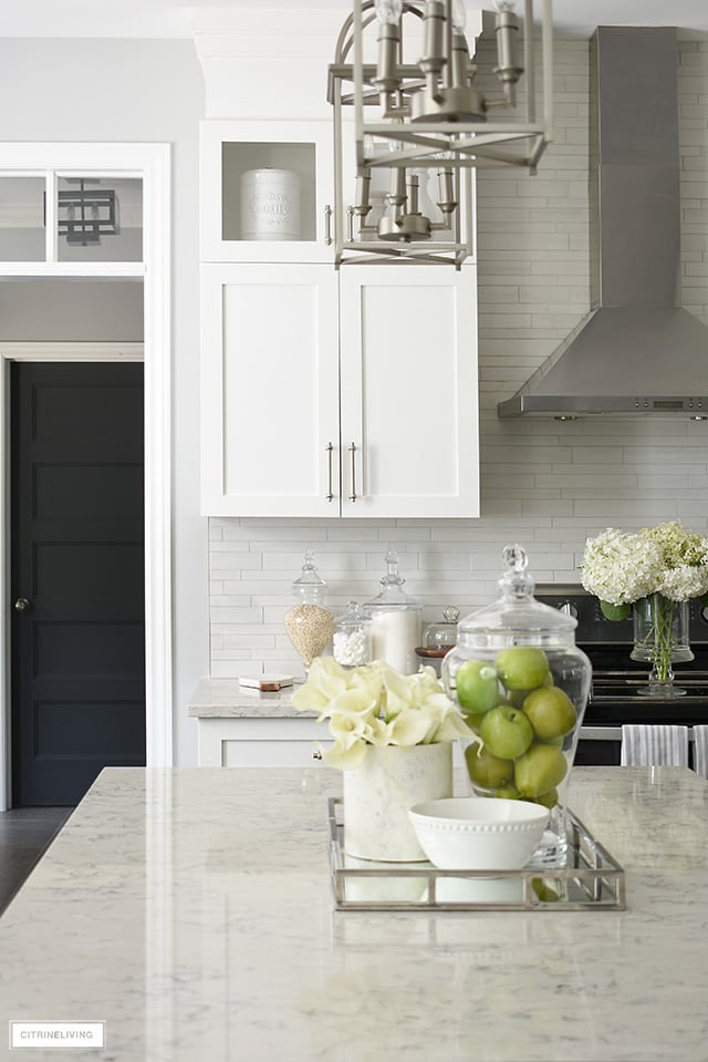 Beautiful classic-meets-modern kitchen with white cabinetry and satin nickel hardware.