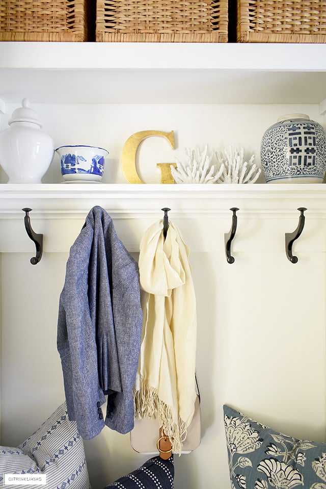 Beautiful chinoiserie decorative accents are chic and elegant in this mudroom/laundry room.