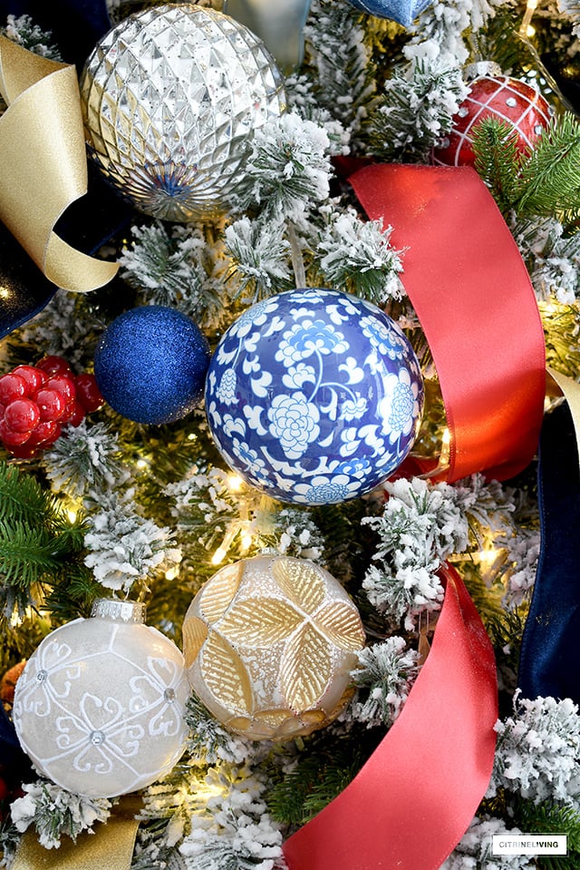 Beautiful and colorful Christmas tree decorations in blue, red, gold, silver and white.