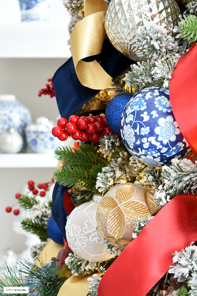 Beautiful and colorful Christmas tree decorations and ribbon in blue, red, gold, silver and white.