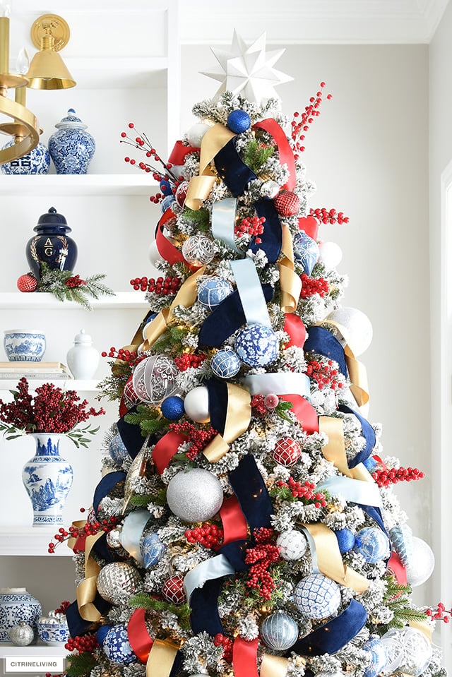 white christmas tree with silver and red decorations