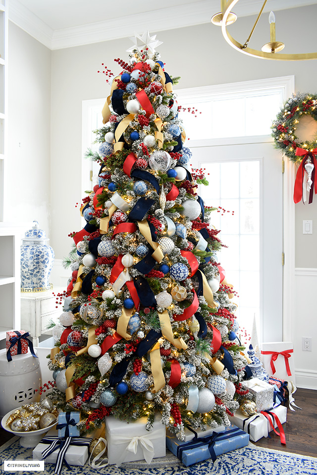 Blue decorated tree with feathers.