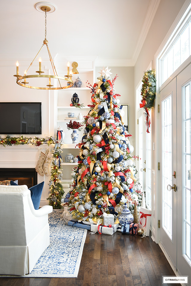 Christmas tree decorated in blue, red, white and gold.