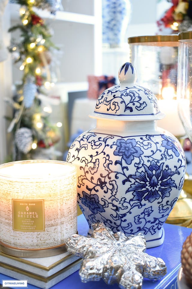 Blue and white ginger jar, Christmas ornament and scented candle.