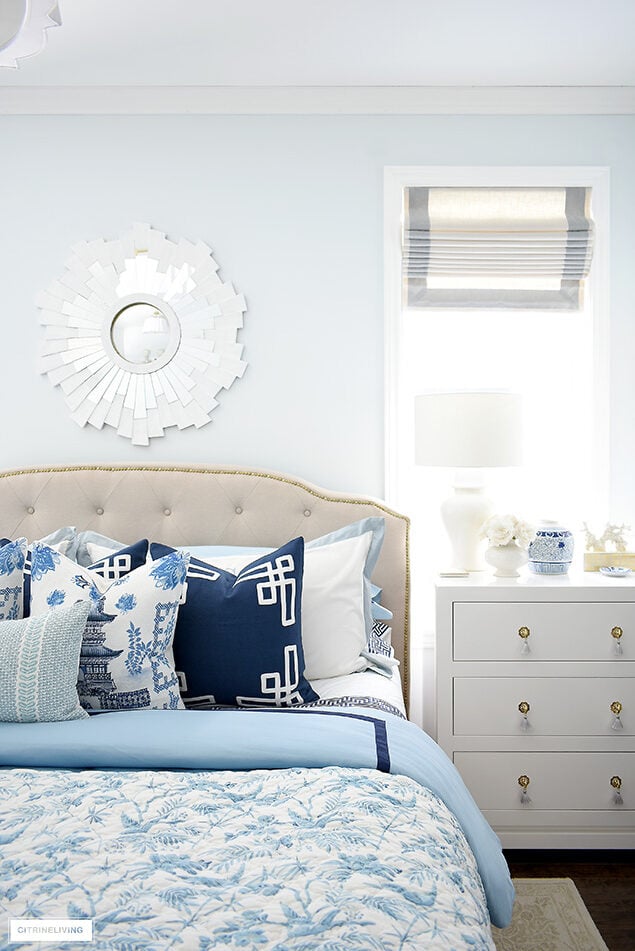 Beautiful bedroom decorated for spring in blue and white chinoiserie.