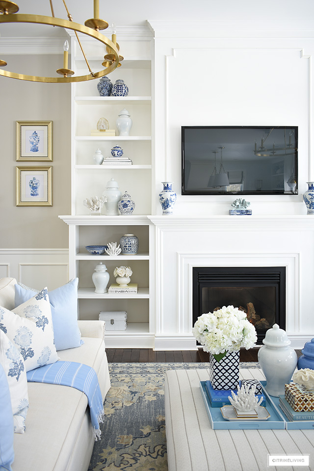 Casual and chic spring living room decorated in hues of blue creamy white and coastal accents. 