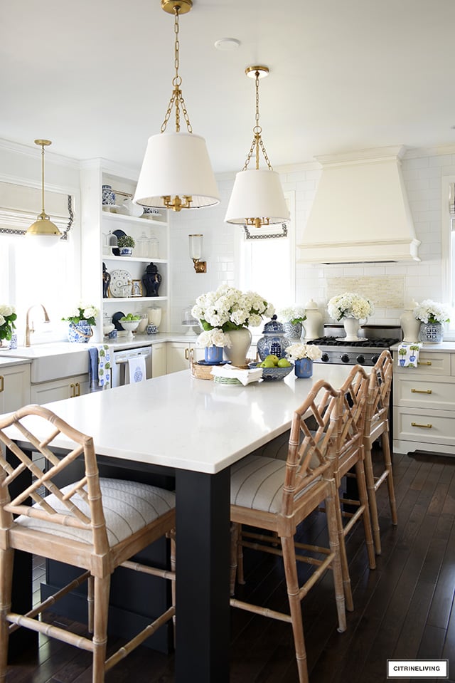 Spring kitchen decorating with florals, blue and white, ginger jars and greenery.