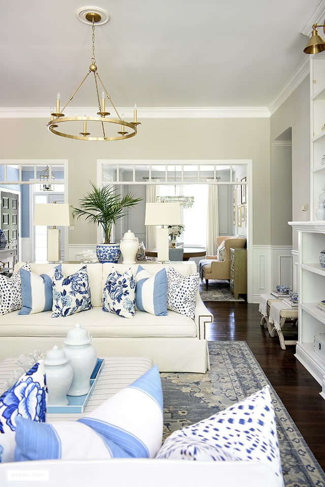 Living room decor for summer in blue and white, chinoiserie and palms.