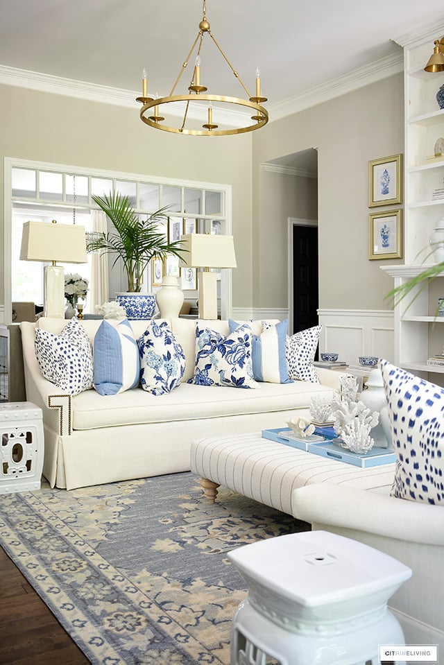 Living room styled in blue and white for summer.