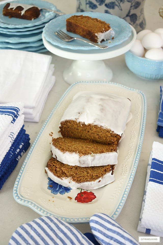 Pioneer Woman dishes and platter featuring a yummy pumpkin loaf with glaze.