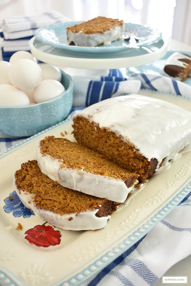 Delicious pumpkin loaf with glaze styled on a beautiful platter.