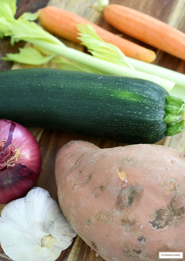 vegetables for cream of vegetable soup - celery, carrots, red onion, garlic, zucchini, and sweet potato.