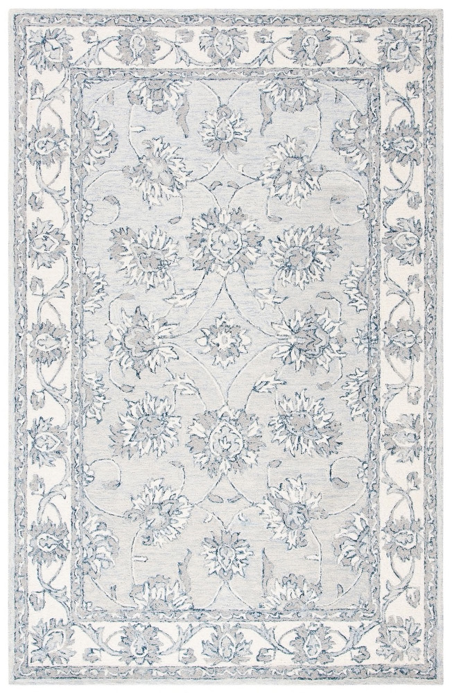 Soft grey and pale blue traditional rug.
