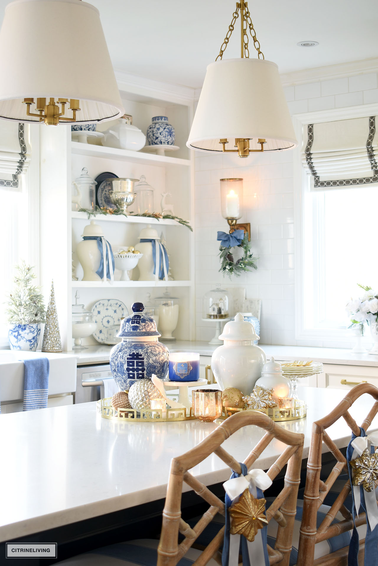 Kitchen Island withe gold trays, ginger jars, candles and ornaments creates a gorge Christmas display.