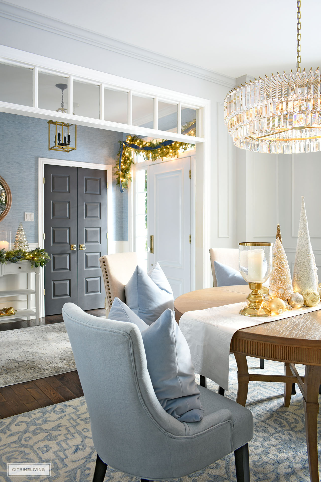 Elegant Christmas decorating in the entryway and dining room.