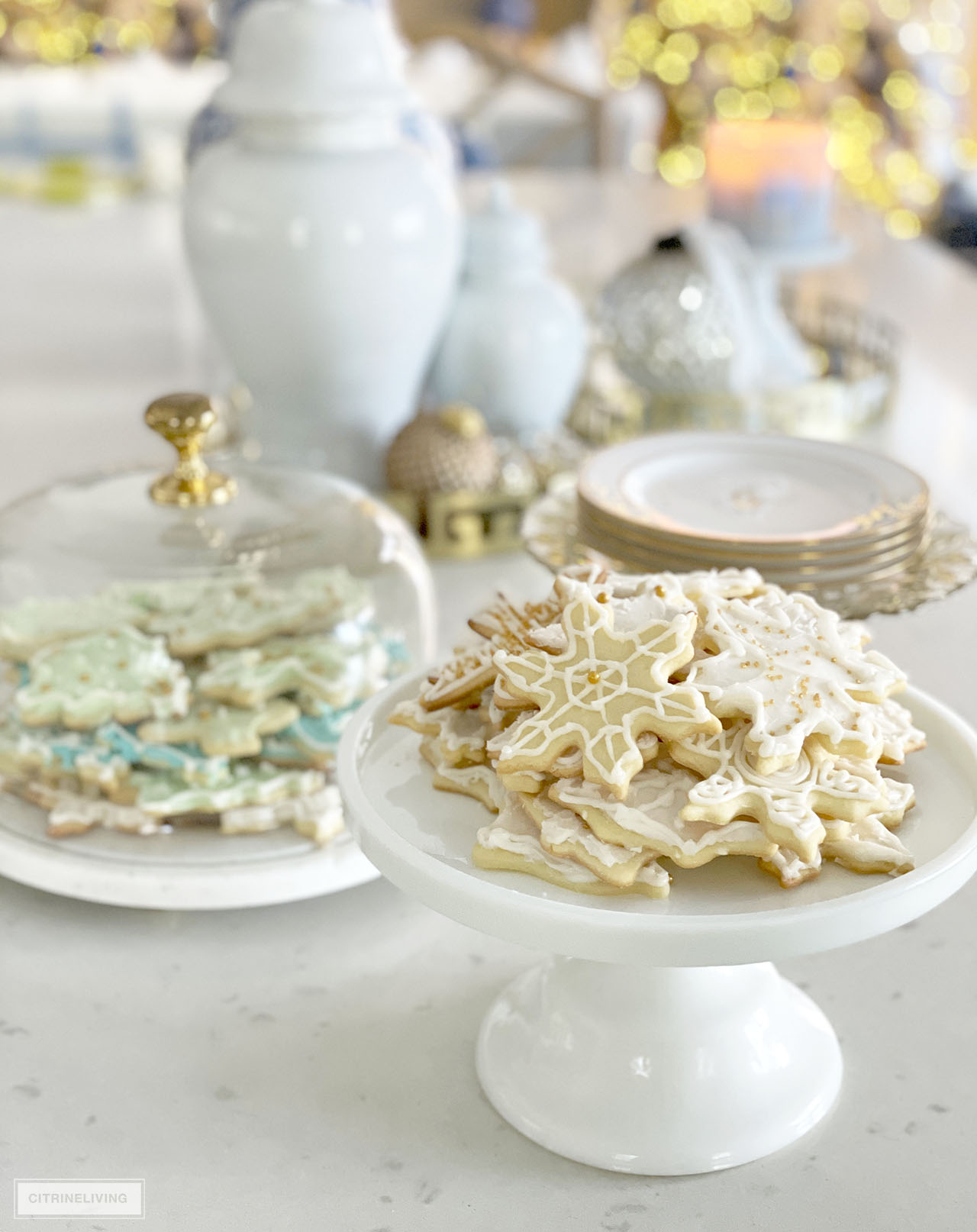 Beautiful frosted Christmas cookies displayed on pretty cake stands is the perfect festive touch!