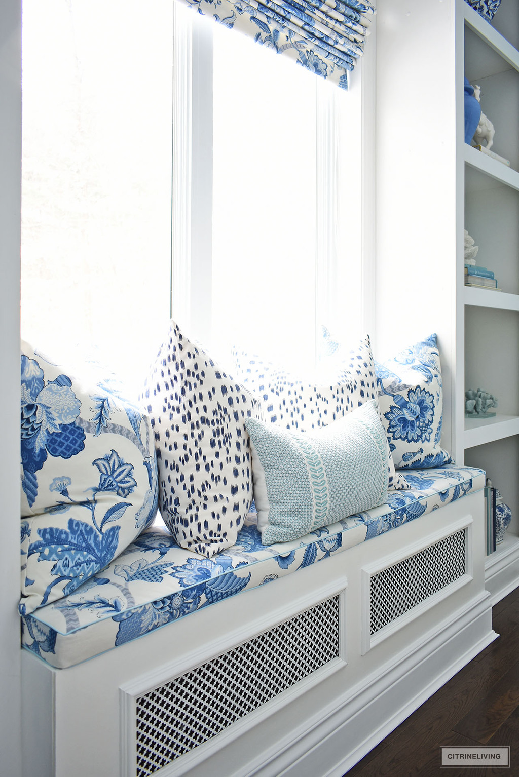 READING NOOK WITH PILLOWS IN ELEGANT HOME OFFICE IN BLUE + WHITE CHINOISERIE