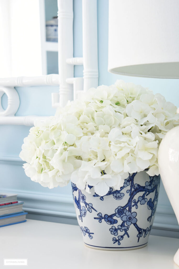 VASE WITH FAUX FLOWERS IN ELEGANT HOME OFFICE IN BLUE + WHITE CHINOISERIE