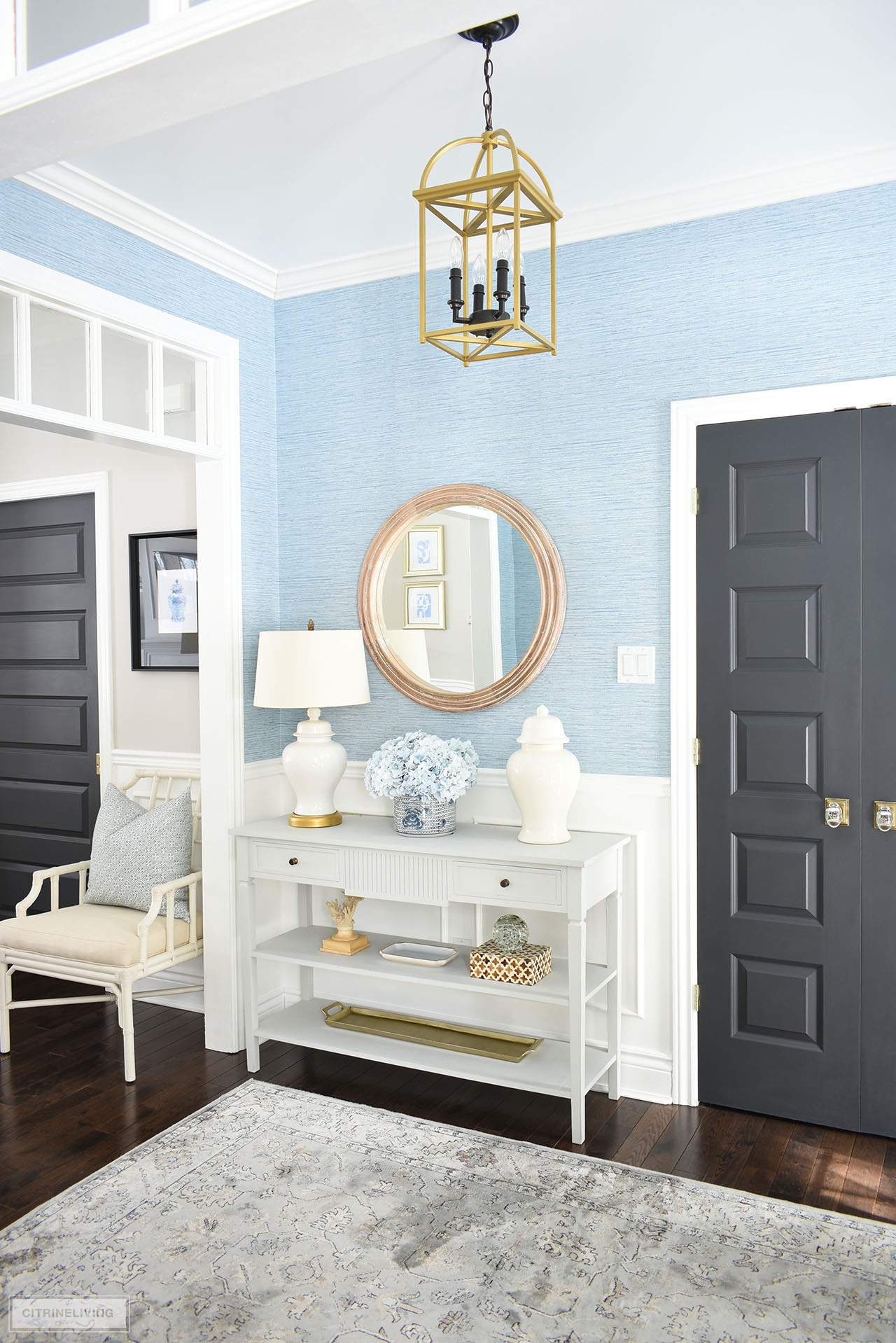 Spring entryway decor with a calming blue and white color palette is classic and beautiful.