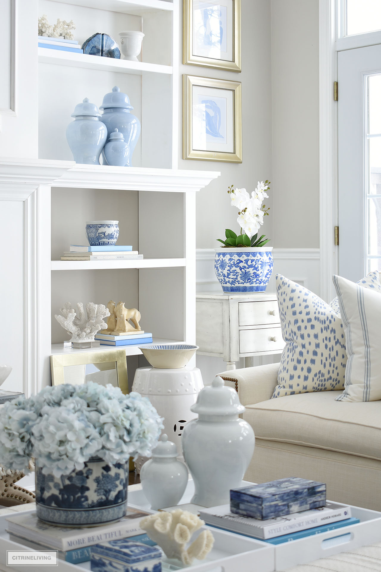 Living room decorated for spring with a beautiful blue and white color palette. 