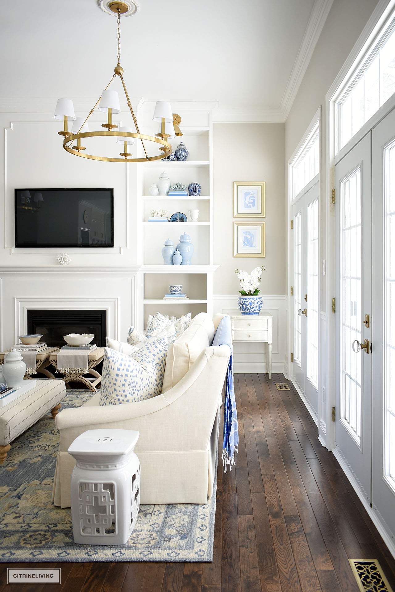 Living room decorated for spring with pretty blue and white decor and accessories.