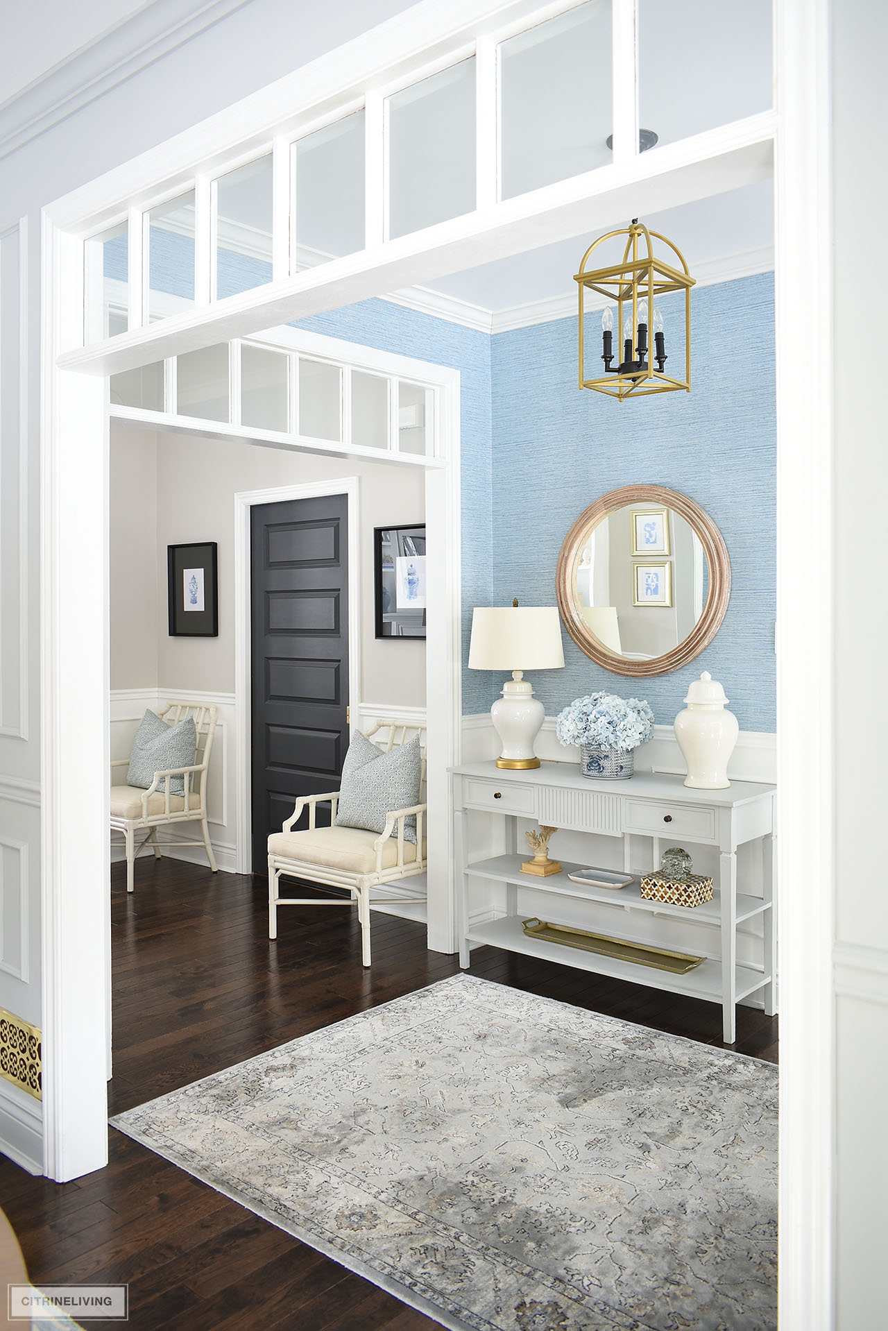 Beautiful and elegant entryway spring decor with a light blue and white color platte.