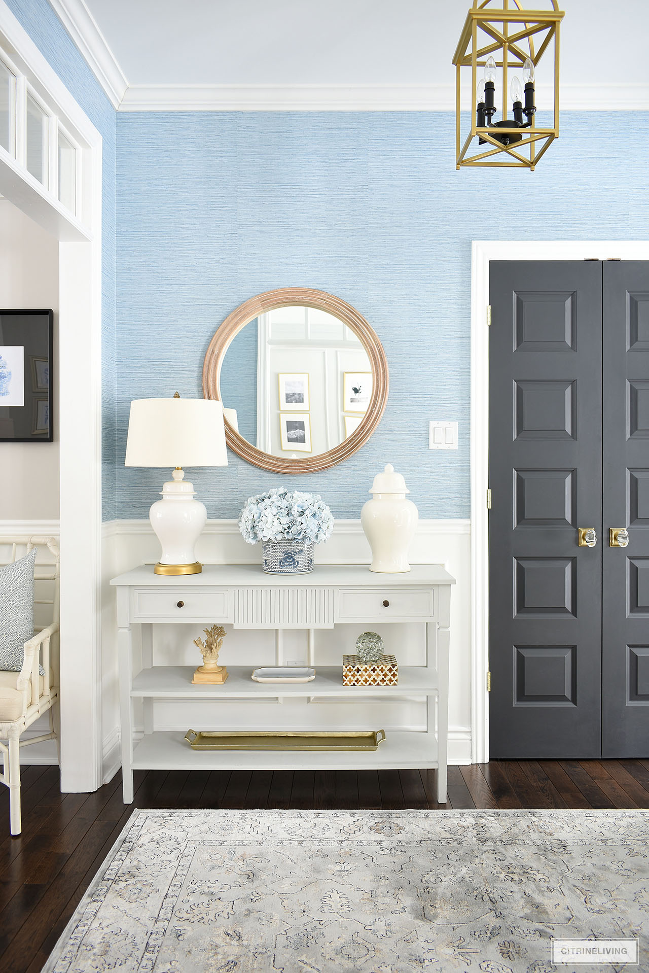 Beautiful and simple entryway spring decorating with a soft blue, white and neutral color palette.