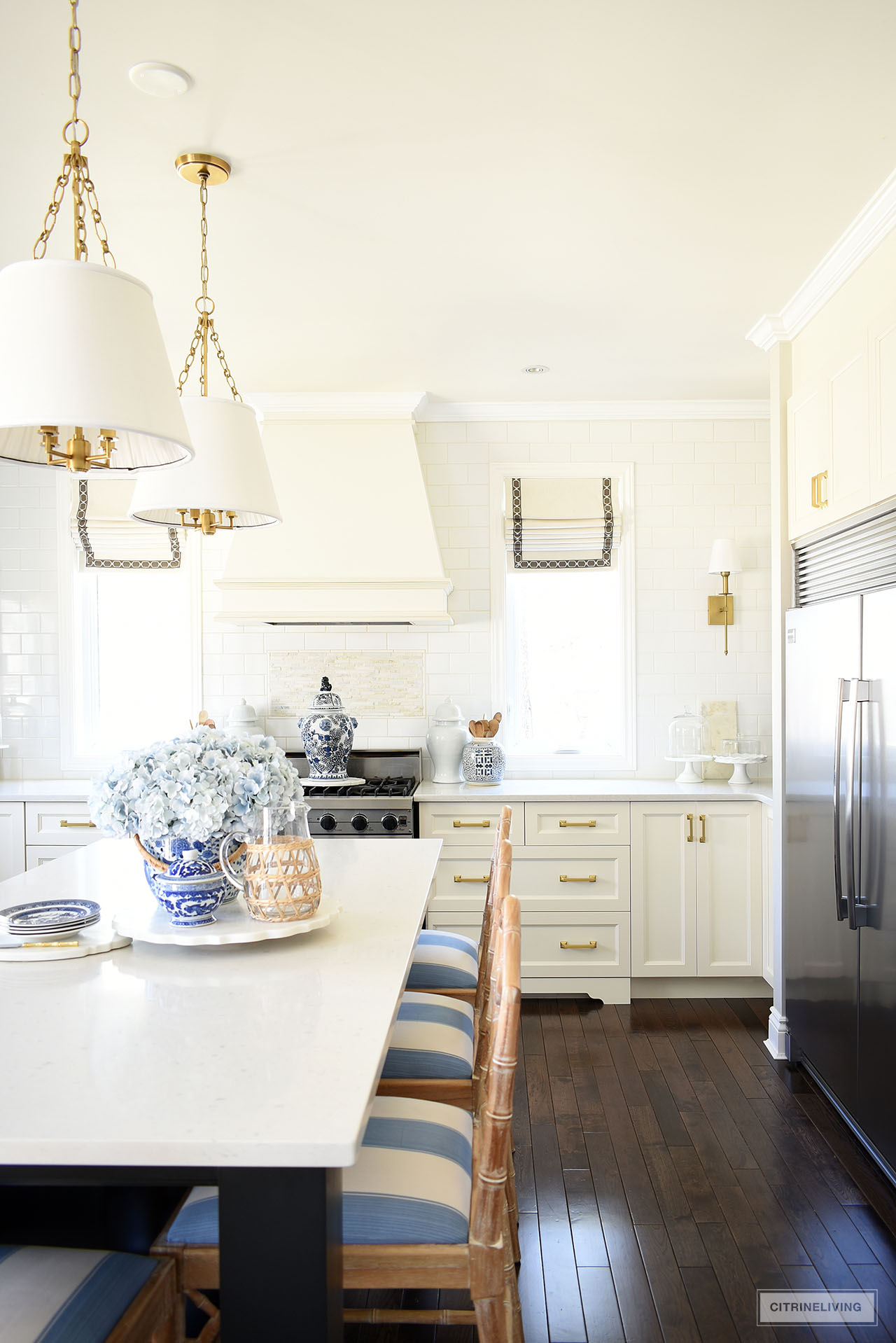 White kitchen decorated for spring with blue and white accents.