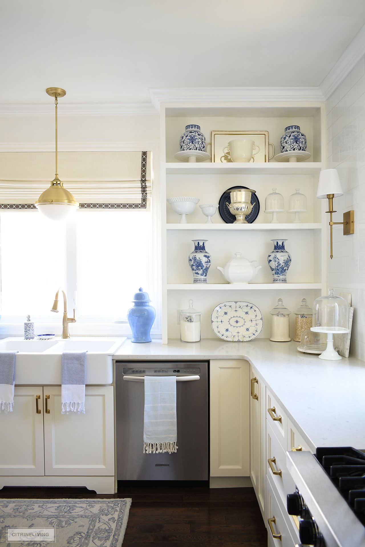 Open kitchen shelves decorated with a blue and white chinoiserie collection.