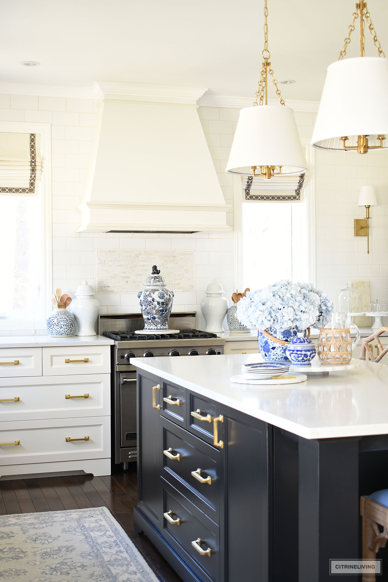 Kitchen island and stove styled for spring with beautiful blue and white chinoiserie pieces.