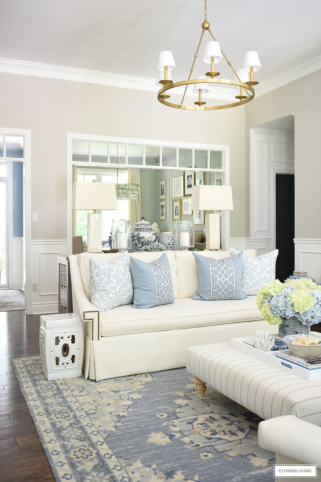 Elegant traditional living room with a modern feel - a light blue and white color palette is light and fresh for summer.