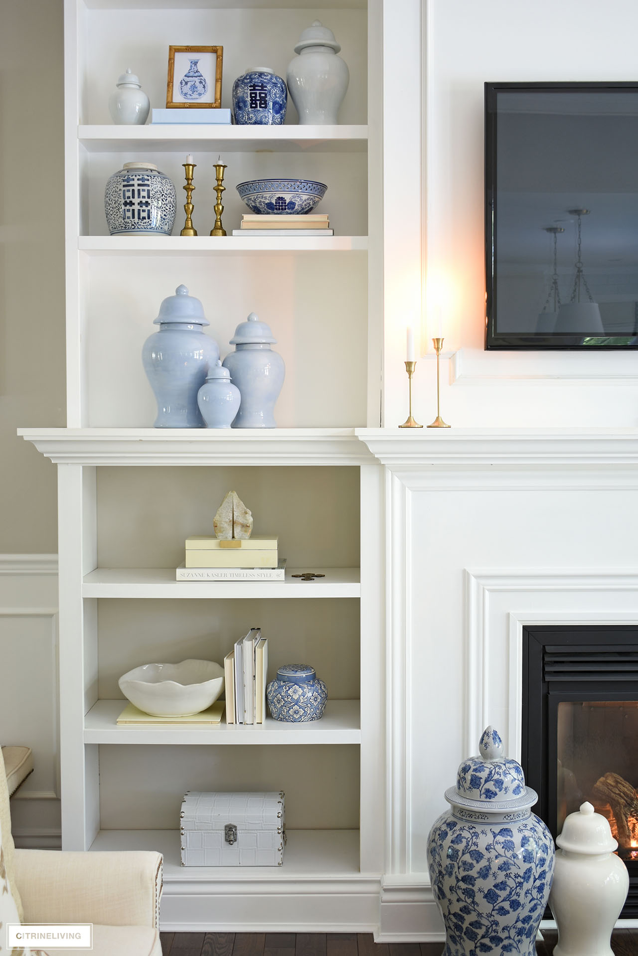 Fall bookshelves with neutral decor and touches of gold.