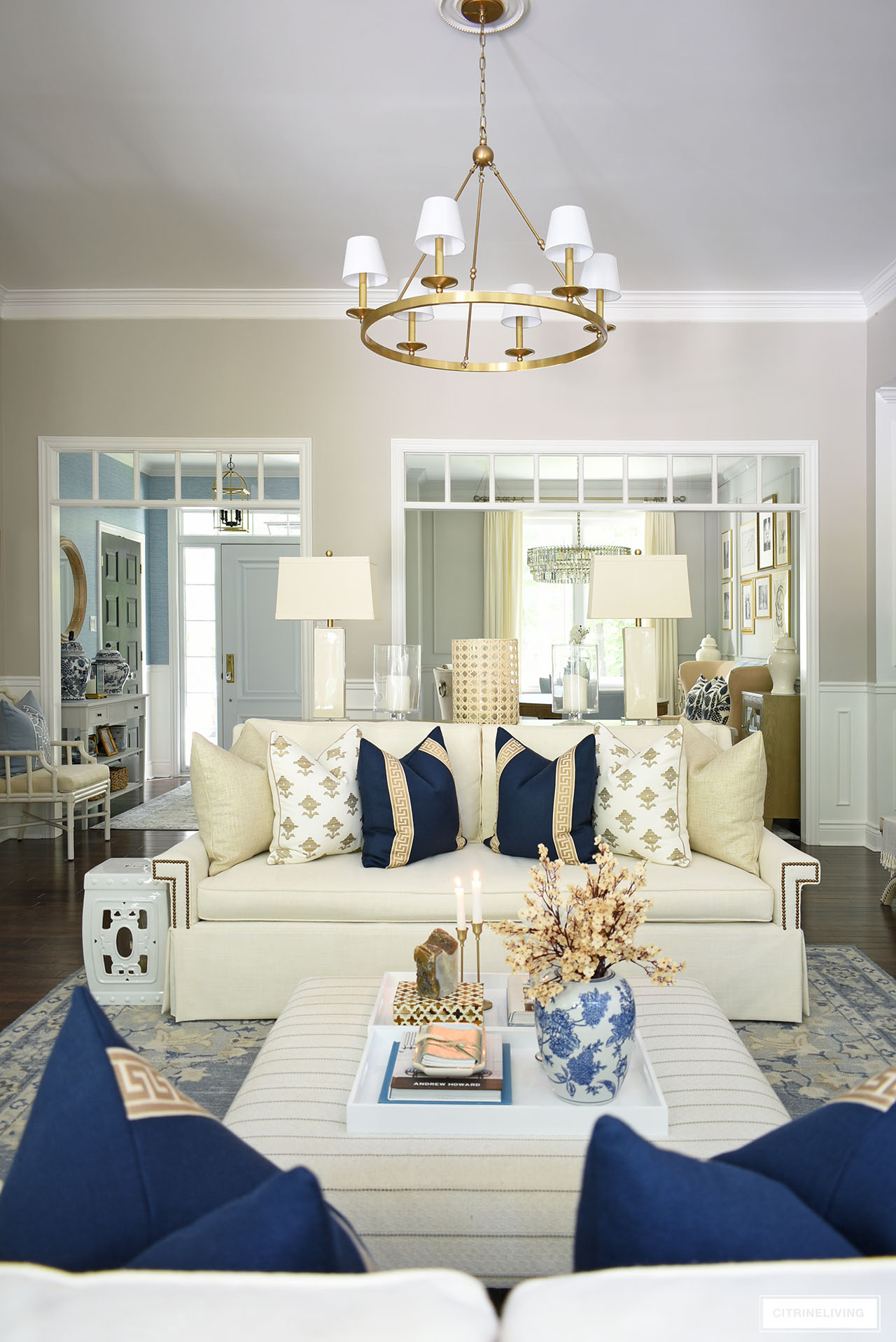 Fall living room decor with navy, tan and white pillows bring an elegant feel to this space.