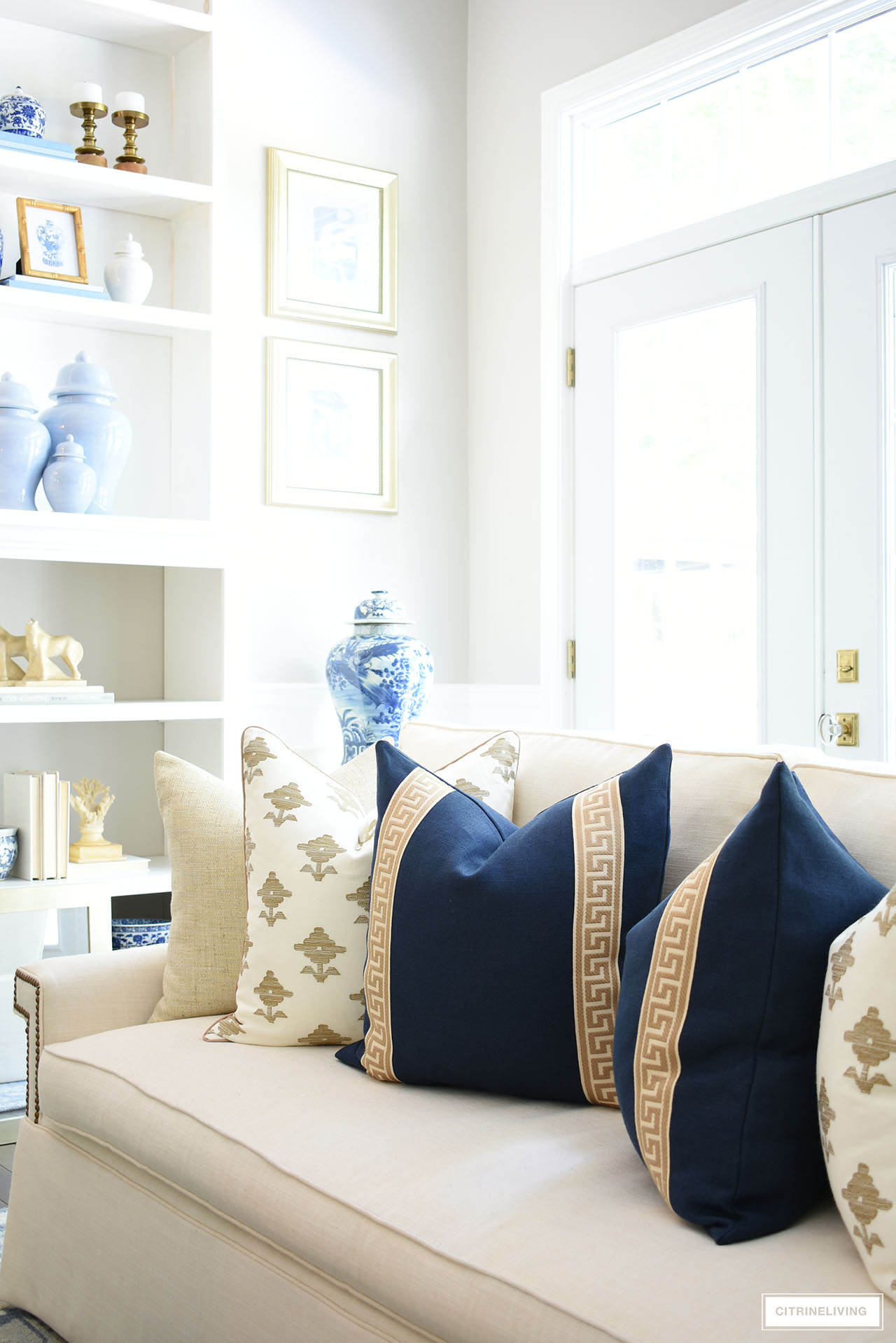 Navy blue, tan and ivory throw pillows are chic and elegant for fall.