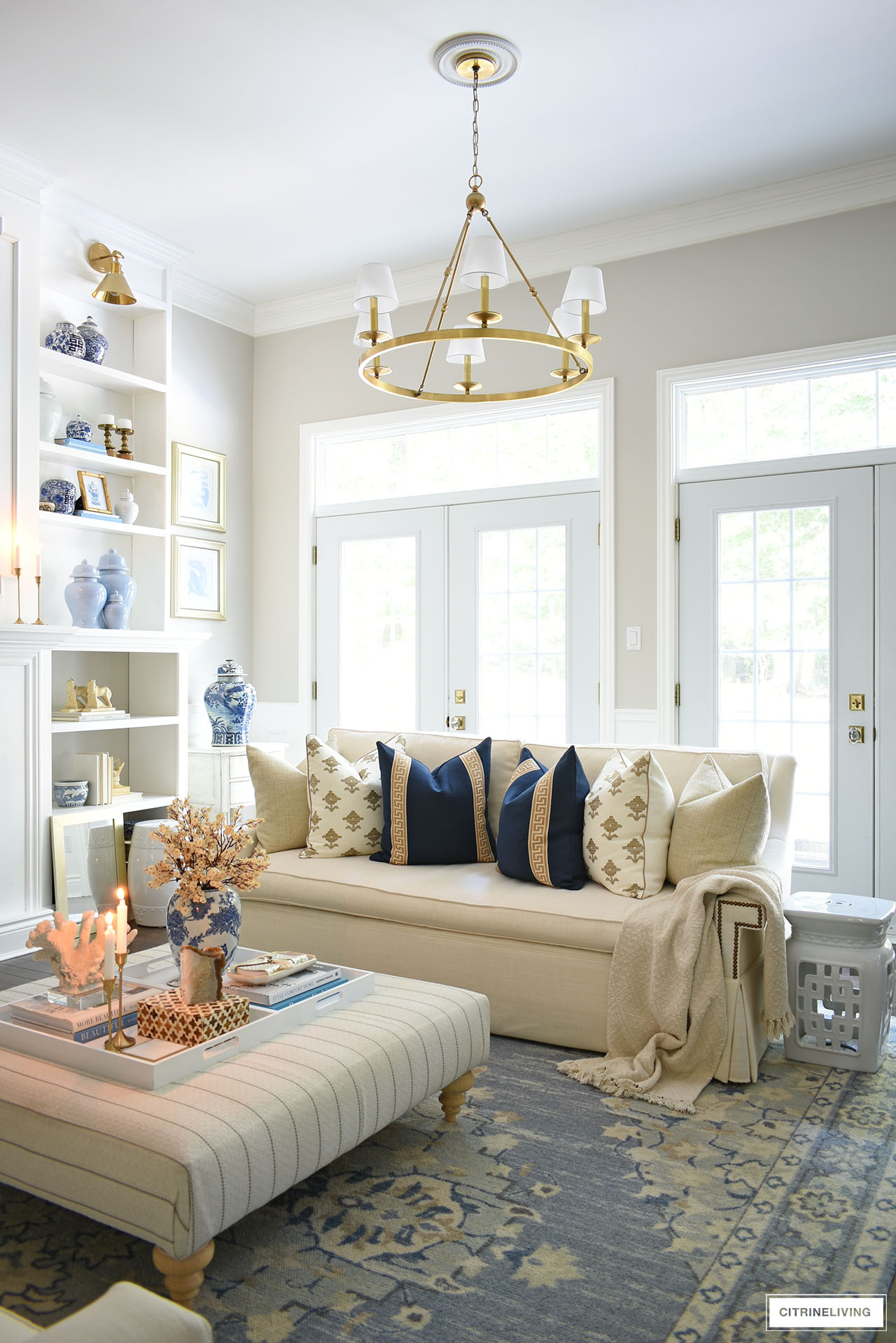 Gorgeous fall living room decorated for fall with rich navy, tan, gold and brown accents.