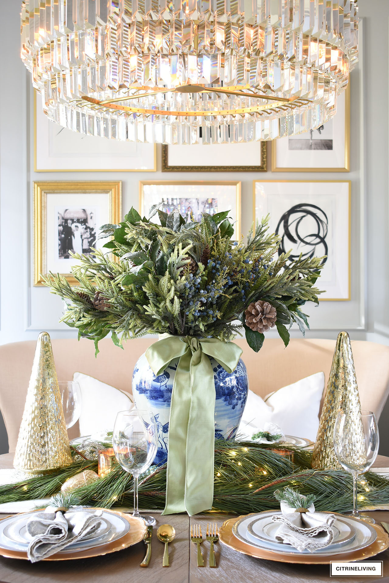 Christmas centerpiece with holiday greenery and blue and white ginger jar