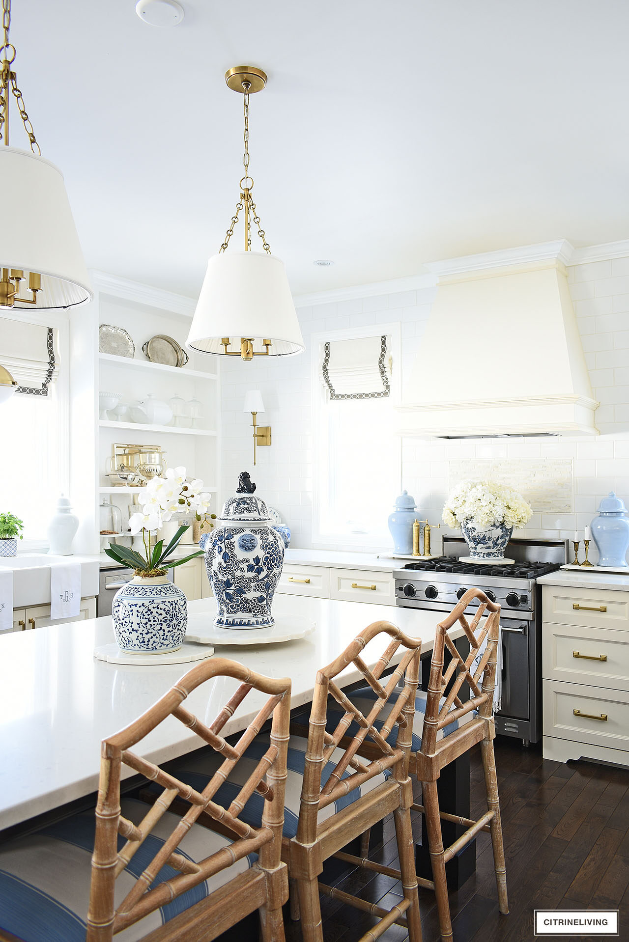 Kitchen decorated for spring with simple touches in blue and white, orchids, hydrangeas and ginger jars.
